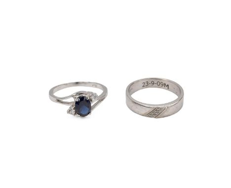 Two 9ct white gold rings, both hallmarked, wedding band set with four diamonds in a diagonal setting with internal inscriptio