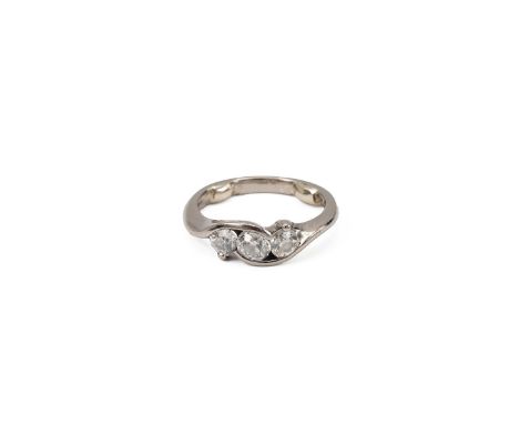 White metal and three stone diamond ring, the twist stem with three brilliant cut diamonds, measuring approximately 0.83 cart