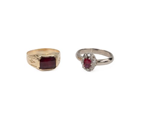 White metal, diamond and ruby set cluster ring, finger size O; along with yellow metal and garnet set ring, finger size M and