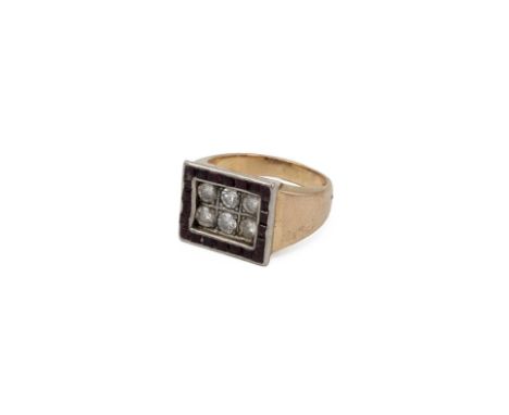 Diamond and ruby set ring, the six brilliant cut stones measuring approximately 0.90 carats, with an outline of square cut ru