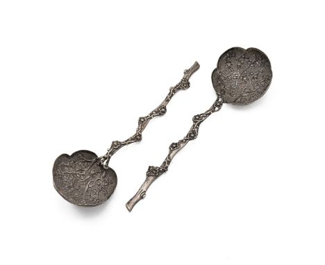 Two Chinese silver serving spoons/ladle, extensively hand tooled repousse of sumptuous boughs of plum blossoms with the long 