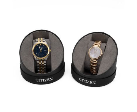 2x boxed Citizen Eco-Drive watches. One gents stainless steel with gold tone details, blue face with gold hour markers and lu