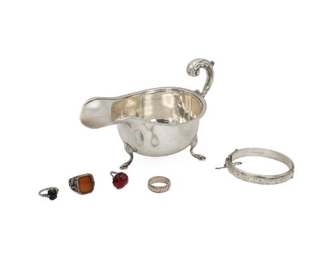 Silver Hallmarked sauce boat&nbsp;and bangle together with four silver rings, three with coloured stones. Gross weight 196g.