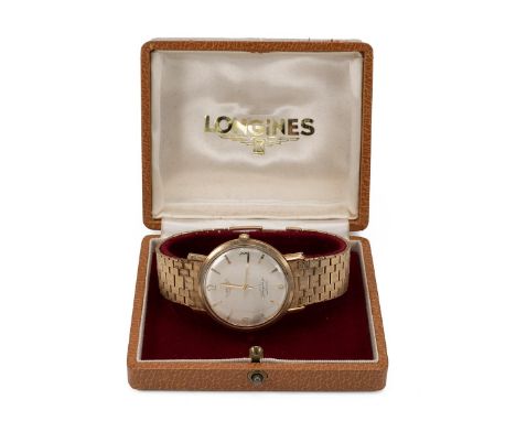 Vintage gents Longines Flagship automatic 9ct gold wristwatch and strap. Silvered dial with gold baton and Arabic hour marker