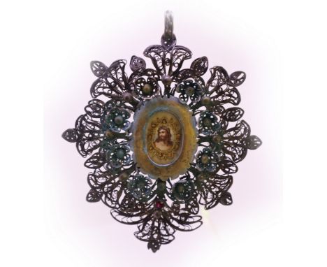 Devotional work in filigree composed of a phytomorphic floral decoration in silver threads that start from one hundred where 