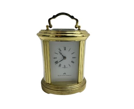 English - 20th century  8-day oval carriage clock, in a polished gilt case with an enamel dial, Roman numerals and moon hands