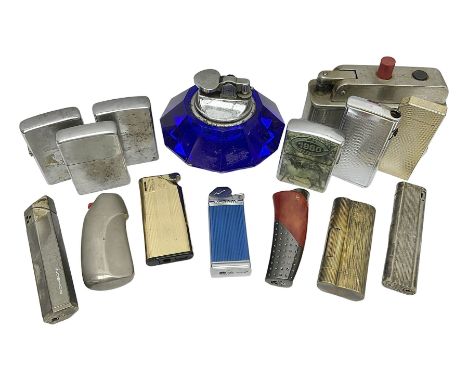 Collection of lighters, including Ronson Varaflame, Zorr Classic, Dunhill bark effect roller gas lighter, and faceted blue gl