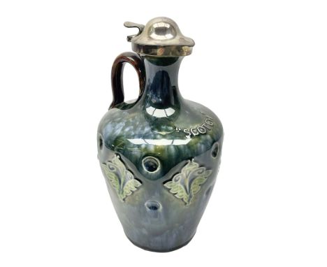 Doulton Lambeth whisky flagon, inscribed 'Scotch' upon a mottled blue green ground, with silver plated cover and stopper, H25