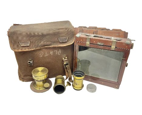 Folding plate camera in mahogany and lacquered brass, with additional plates and case