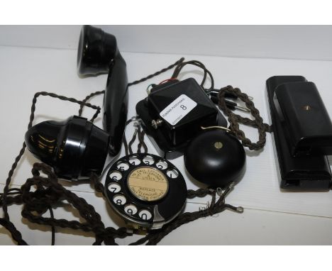 Black handset with brown braided cord, black metal numbers only dial, a DC trembler bell low voltage with braided test cord (