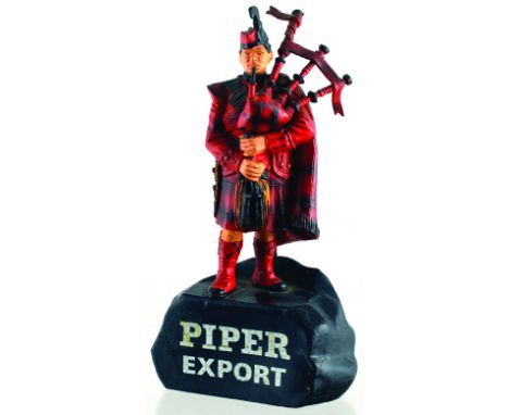 PIPER EXPORT BACK BAR FIGURE. 6.5ins tall, rubberoid figure of Scotsmanin tartans, playing bag pipes. PIPER/ EXPORT in white 