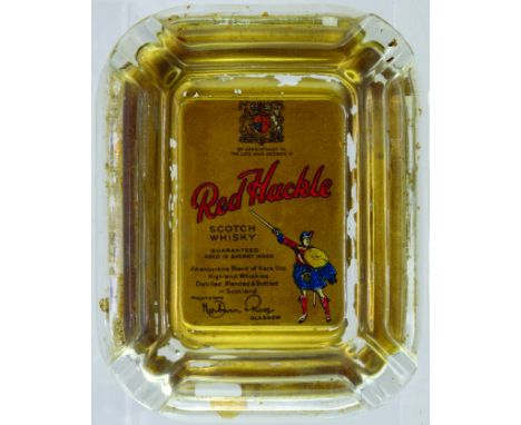 Red Hackle/ SCOTH/ WHISKY GLASS ASHTRAY. 5 x 6.25ins. Printed to the rear with pictorial image of sword & shield holding kilt