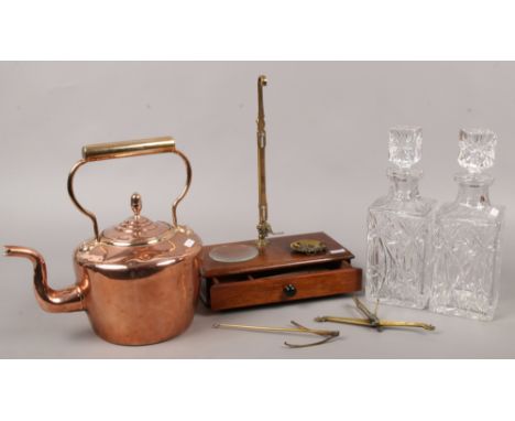 A set of W &amp; T Avery chemist scales, along with a copper kettle and two cut glass decanters.