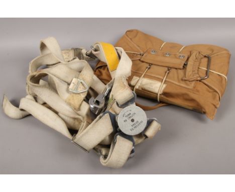 An RAF type C. MK2 chest pattern parachute harness and parachute pack with military broad arrow marks.Condition report intend