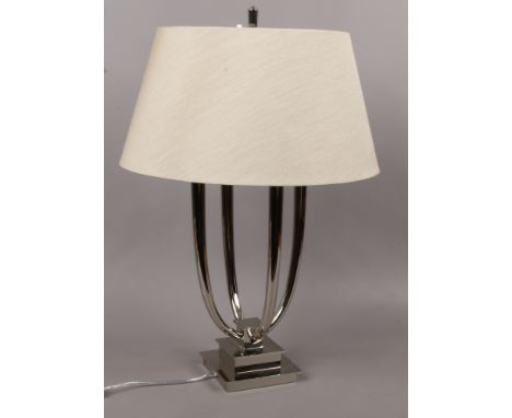 An Aurora nickle four branch table lamp.