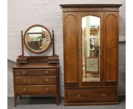 An Edwardian mahogany mirror front wardrobe (195cm x 106cm x 51cm) and dressing table (165cm x 92cm x 53cm) quarter veneered 