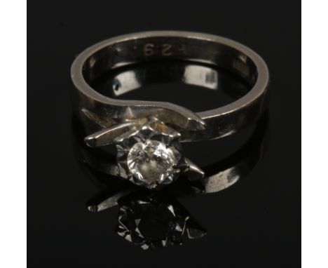 A ladies 18ct white gold diamond solitaire ring in modernist setting approximate 0.3ct (4.11g). Size K.