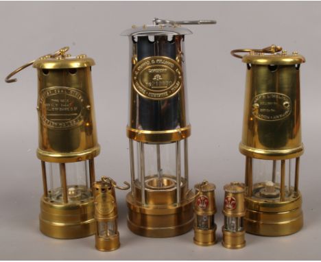 A collection of brass miners lamps to include E. Thomas &amp; Williams Ltd, Hockley lamp &amp; Limelight Company, miniature e