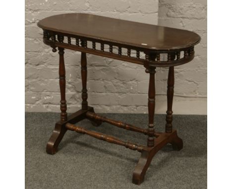 A Victorian mahogany oval side table.