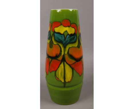 A large Poole Delphis vase stamped 85 decorated in early glaze in tones of red, yellow and blue in a abstract design, 39.5 cm