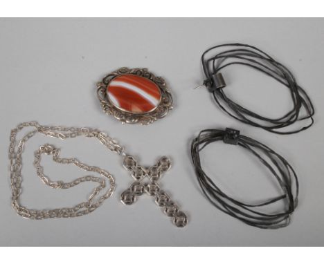 A pair of Jenny Gill oxidised silver hoop earrings, a Jack Spencer cross and chain and a silver agate brooch.