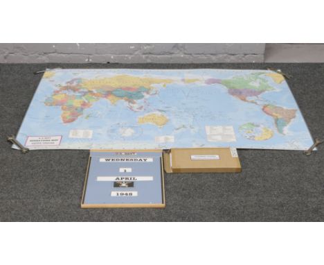 Two World War II replica props; a US Navy date adjustable calendar board and a large scale map of World War II theatre of ope