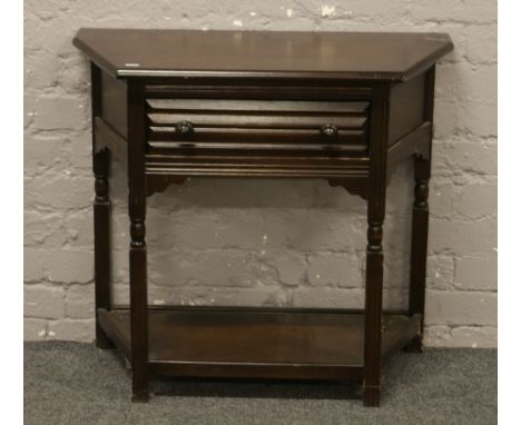 An oak two tier single drawer hall table.