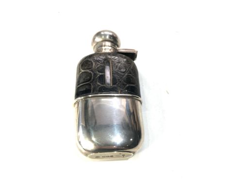 Antique silver and leather mounted hip flask measures approx 13cm by 6cm,&nbsp;Item is in good overall condition,, seals and 