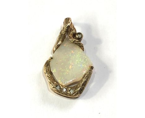 9ct gold opal and diamond pendant measures approx 2.8cm drop by 1.6cm wide weight 3g 