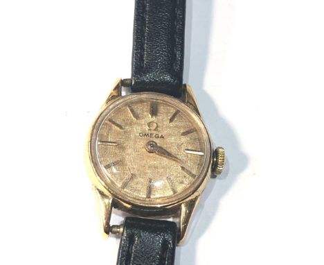 Vintage 18ct gold ladies Omega wristwatch hand winding linen dial watch is ticking but no warranty given 