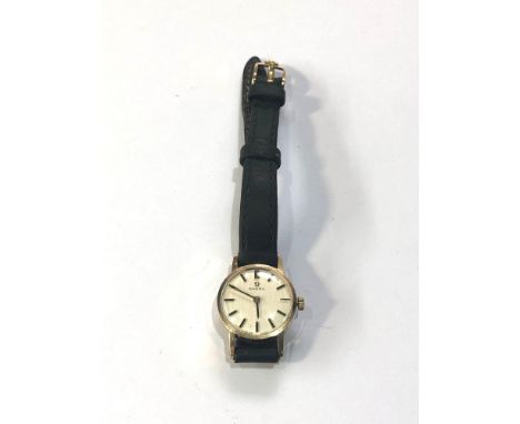 Ladies vintage 9ct gold Omega wristwatch omega black leather strap plated buckle in working order but no warranty given 