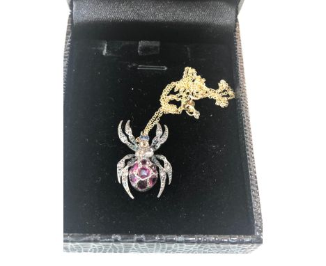 Rose diamond and ruby set spider pendant on 18ct gold chain body and legs set with old cut rose diamonds and ruby set body wi