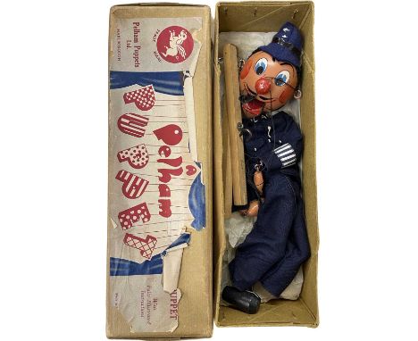 A boxed Pelham SM Policeman marionette puppet