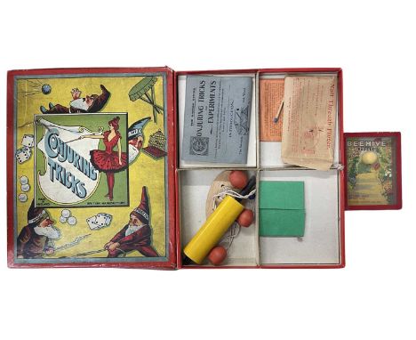 A pair of vintage pasttimes, to include: - Boxed set of  The British Series: Conjuring Tricks - Beehive puzzle by R Journet &