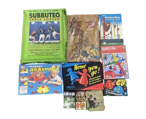 A collection of vintage board games and jigsaw puzzles, to include: - Subbuteo Table Soccer: Continental Club Edition - All A