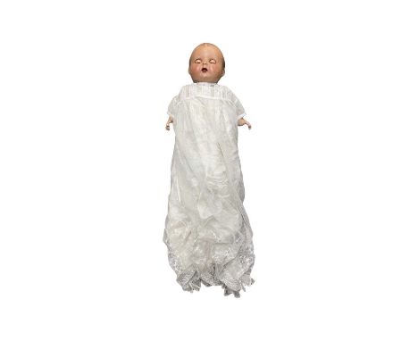 A 1930s European composite doll with straw filled body, sleeping brown eyes and open mouth. Very well loved with some age rel