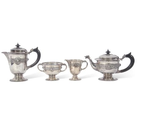 George V Irish silver tea set of circular baluster form with applied banded Celtic decoration, each item engraved with a mono