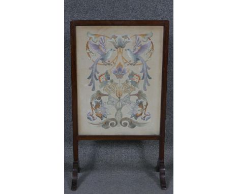 A C.1900 mahogany fire screen with glazed tapestry panel. W.47 H.82 