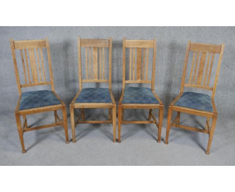 A set of four late 19th century Arts and Crafts influenced light oak dining chairs. H.102.cm 