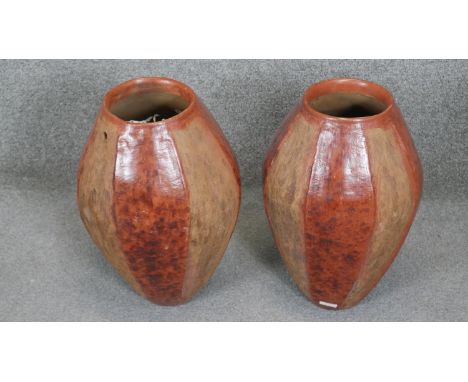 Two ovoid terracotta effect ceramic vases with coloured banding. H.49CM 