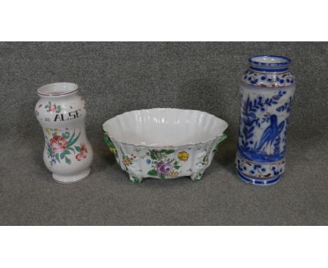 A collection of Majolica. Including a planter with floral design, a hand painted vase P. de Alse inscribed and a blue and whi