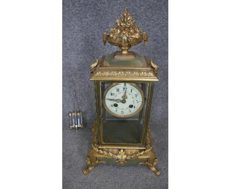 A 19th century french gilt ormalou and alabaster mantle clock by Samuel Marti, Paris. It has a fruit filled urn finial, white