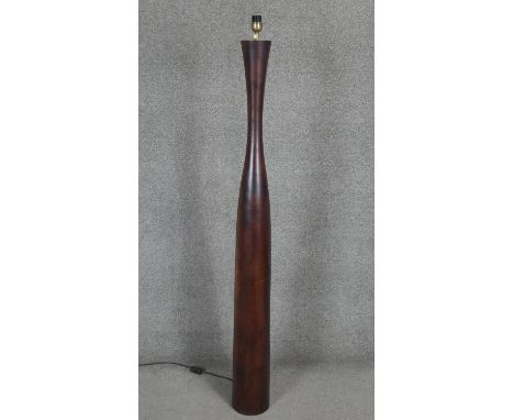 A large stained and tapering wooden standard lamp. H.158 