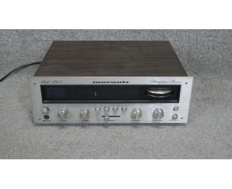A teak and chrome Marantz stereo reciever model 2015 with cable. H.13 W.35 