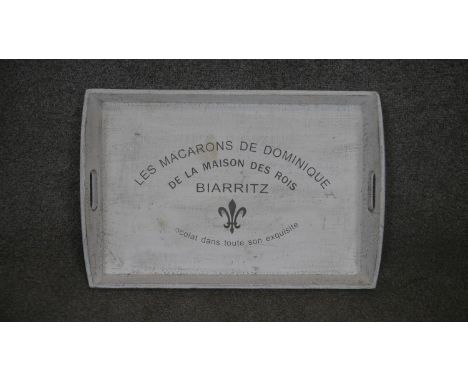 Les Macarons de Dominique painted wooden tray and a white metal enamel tray with black wording.  H.37 W.50cm 