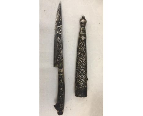 An Eastern dagger with silver inlay and scabbard