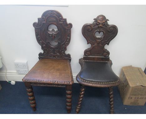 Two 19th century hall chairs, one carved with North Wind/Green Man face on bobbin legs, the other with padded seat and grotes