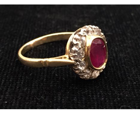 An 18ct ruby and diamond dress ring