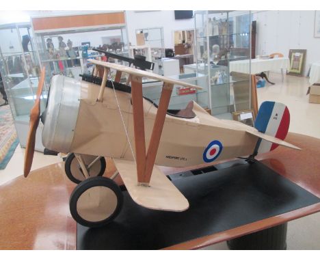 A unique pedal bi-plane, by Tri-Ang Lines Bros, made for display in Hamleys of London based on a World War I Nieuport 1761 wi