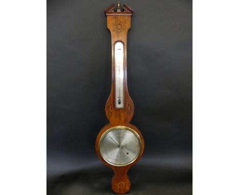 A late Georgian mahogany cased barometer Of typical form with broken arched pediment and inlaid shell and flower detail, the 